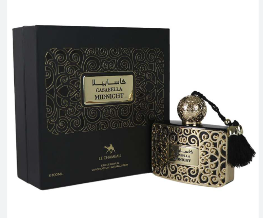 Le Chameau Cashella Midnight perfume bottle with ornate gold detailing, shown next to its black presentation box with gold patterns and Arabic text.