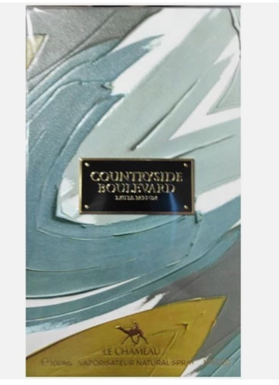 Le Chameau Countryside Boulevard Eau de Parfum spray bottle packaging, featuring an abstract textured design in light blue, gray, and gold with a central black and gold brand plaque.