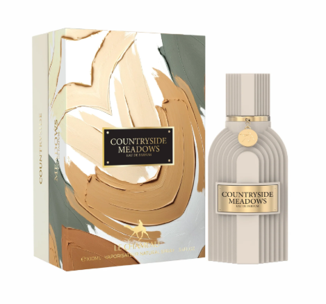 Countryside Meadows Eau de Parfum bottle and its matching box. The bottle is a ribbed off-white color with a gold label and cap, and the box features an abstract gold, beige, and gray paint design with a black label.