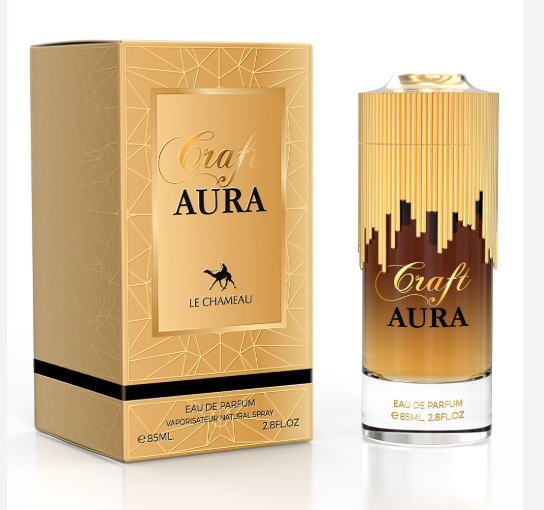 Craft by Aura Eau de Parfum by Le Chameau, shown with its gold packaging box and the cylindrical glass perfume bottle featuring a gold and black city skyline design.