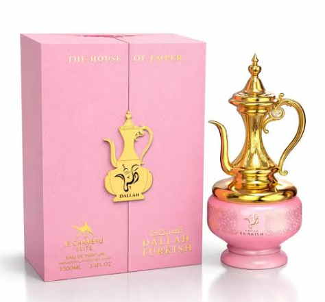 Dallil Turkish Essence Eau de Parfum bottle and its pink packaging box. The bottle features a shiny gold teapot-shaped atomizer on a pink base, and the box is light pink with gold lettering.