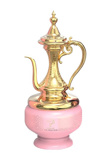 A traditional Turkish coffee pot with a shiny gold metal body and handle, resting on a round pink ceramic base against a plain white background.