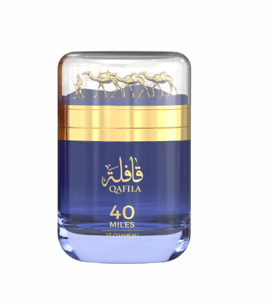 A bottle of Qafila 40 Miles cologne, featuring a deep blue body with a metallic gold band and gold lettering, topped with a clear cap showing gold camel silhouettes, set against a plain white background.