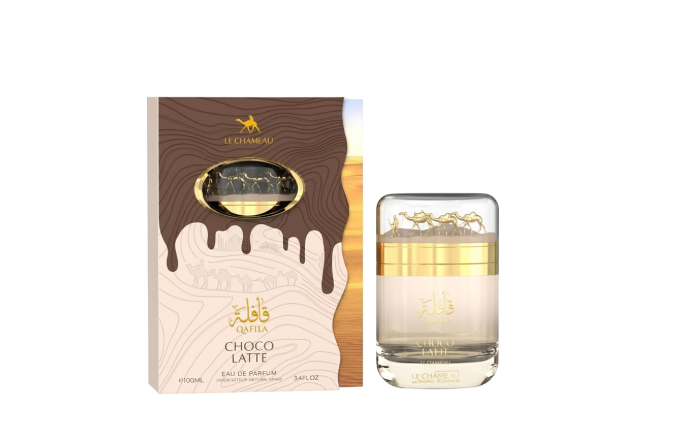 A bottle of Fattamiglio Choco Latte Eau de Parfum next to its retail box. The packaging features a brown chocolate-coated look with white wavy lines and gold lettering, and the clear glass bottle contains a light beige fragrance liquid with a gold cap.