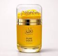 A bottle of Le Chambeau Qafila Pure Gold perfume with a transparent cap showing three gold camels, a yellow body, and gold accents, set against a plain white background.