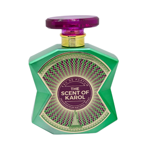 A green faceted perfume bottle with a purple cap and a gold and purple label reading 'THE SCENT OF KAROL' and 'EAU DE PARFUM'.