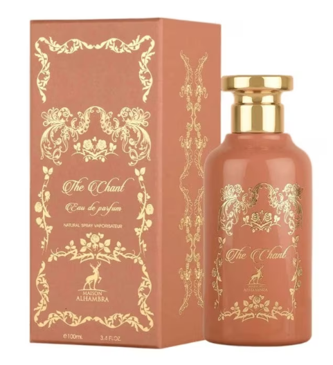 A bottle of Alehambra 'The Chant' Eau de Parfum next to its matching pinkish-brown box, both decorated with elegant gold foil patterns.