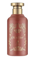 A dusty rose pink bottle with a gold cap and gold ornate floral detailing, featuring the text 'The Chant' and 'ALHAMARA' on the front, set against a plain white background.