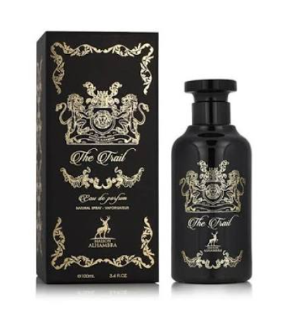 A bottle of Allamara 'The Trail' eau de parfum next to its black packaging box, both featuring ornate gold crest designs and lettering on a white background.