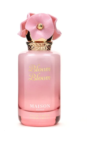 Maison Paris Bloom Bloom Eau de Parfum bottle in pink glass with a pink flower cap and gold lettering, on a white background.