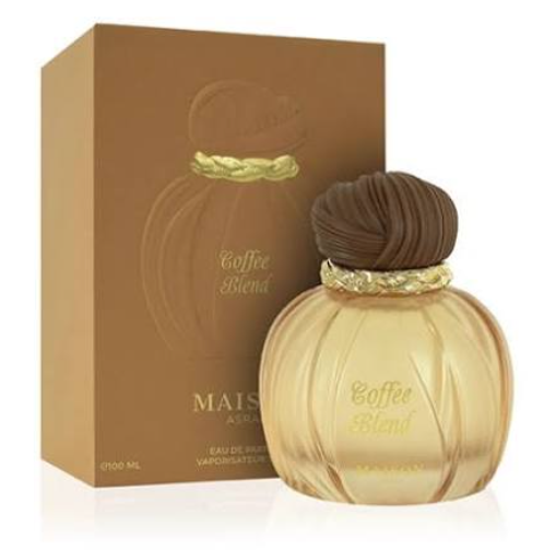 Maisa Aroma Coffee Blend Eau de Parfum bottle with a ribbed golden-amber body, dark brown cap, and a matching brown box in the background.
