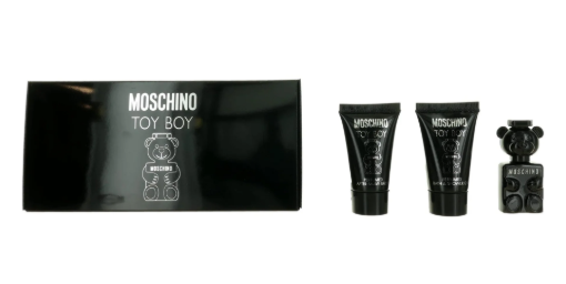 Moschino Toy Boy fragrance gift set on a white background, featuring a black box with a white teddy bear logo, two black tubes, and a small black bear-shaped bottle.