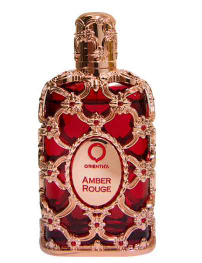 Orienta Amber Rouge perfume bottle with a red patterned glass body and ornate rose gold metal detailing, on a white background.