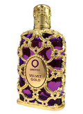 Orientika Velvet Gold perfume bottle with an ornate gold filigree design over a deep purple background, featuring a gold cap and a central oval label.
