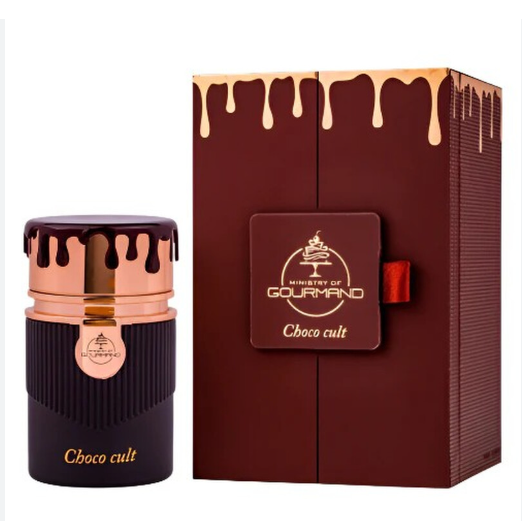 A bottle of Gourmand Ministry of Choco cult chocolate perfume or fragrance shown beside its matching box. The bottle is dark brown with metallic rose-gold/champagne drip detailing and gold lettering reading 'Choco cult' and the Gourmand logo.