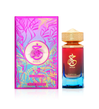 Khair Euphoric Eau de Parfum bottle and its packaging box. The bottle features a gradient from red to blue with a gold cap, and the box is vibrant pink with gold tropical leaf patterns.