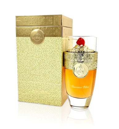 A bottle of Banana Boat perfume with amber liquid and a gold cap, standing next to its textured gold packaging box on a white background.