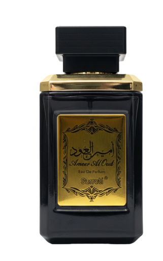 A black rectangular perfume bottle with a gold label and gold collar, featuring Arabic calligraphy and the brand name 'Surroti'.